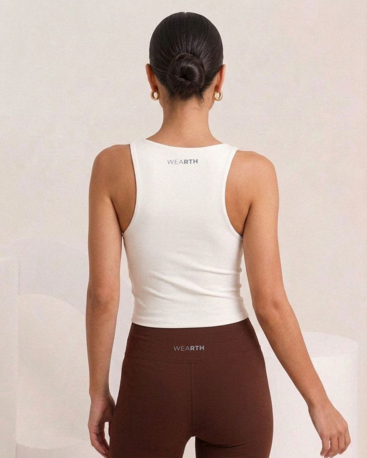 White tank and brown flare, back wordmark, eucalyptus fibre activewear by WEARTH India White tank and brown flare, back wordmark, eucalyptus fibre activewear by WEARTH India