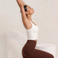 White tank, arms up, eucalyptus fibre activewear by WEARTH India