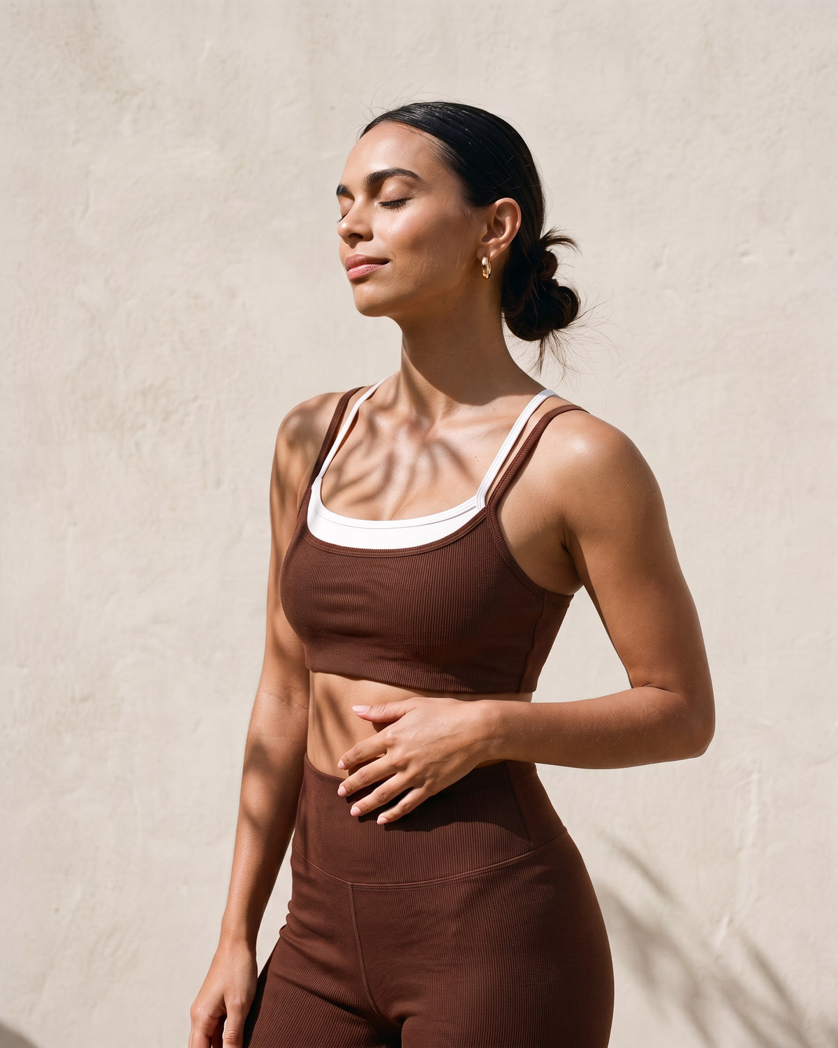 Morning sun on The Heartwood Set: the white inner layer showing at the neckline of the brown bralette
